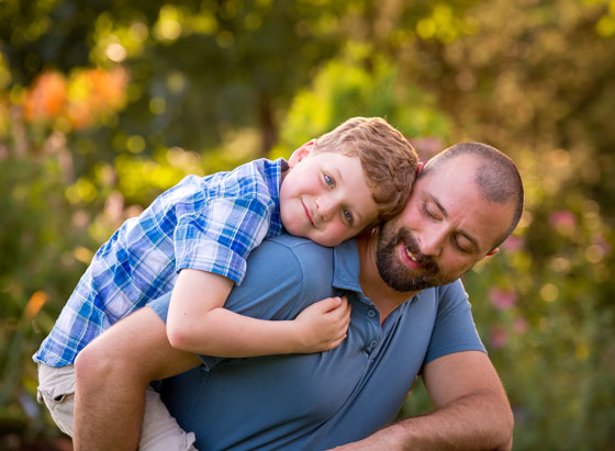 Phineas smiles while hugging his dad