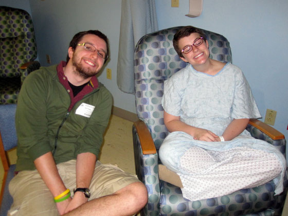 Sarah and Patrick sitting and smiling