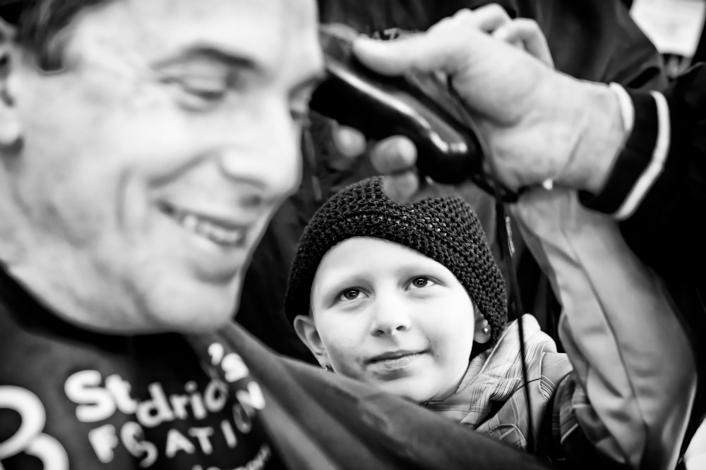 Dr. Dan Wechsler gets shaved at a St. Baldrick's event