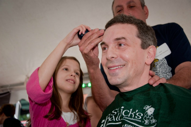 Dr. Dan Wechsler gets shaved at a St. Baldrick's event