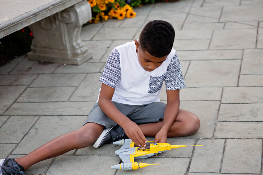 Isaac playing with his lego spaceship