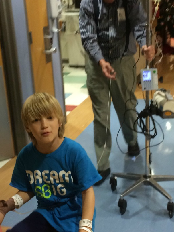 Alex rides his bike around the hospital