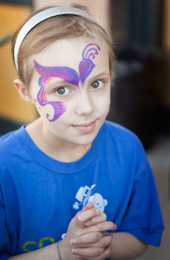 Avery with face paint at a St. Baldrick's event