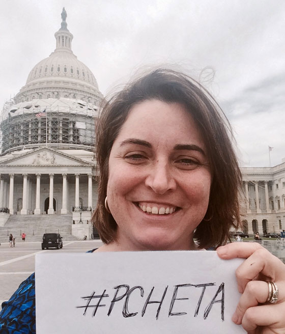 Danielle holds a PCHETA sign