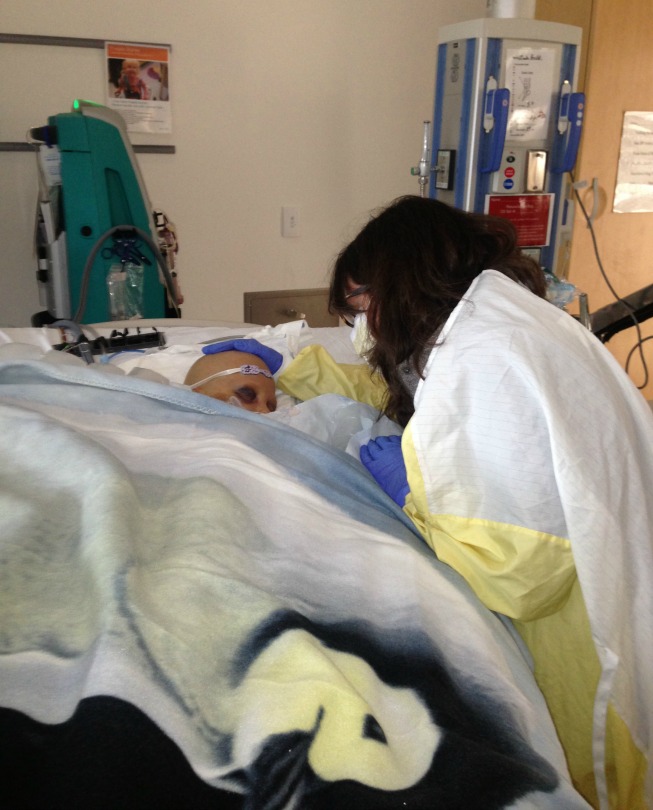 Dr. Jessica Pollard at the bedside of one of her patients