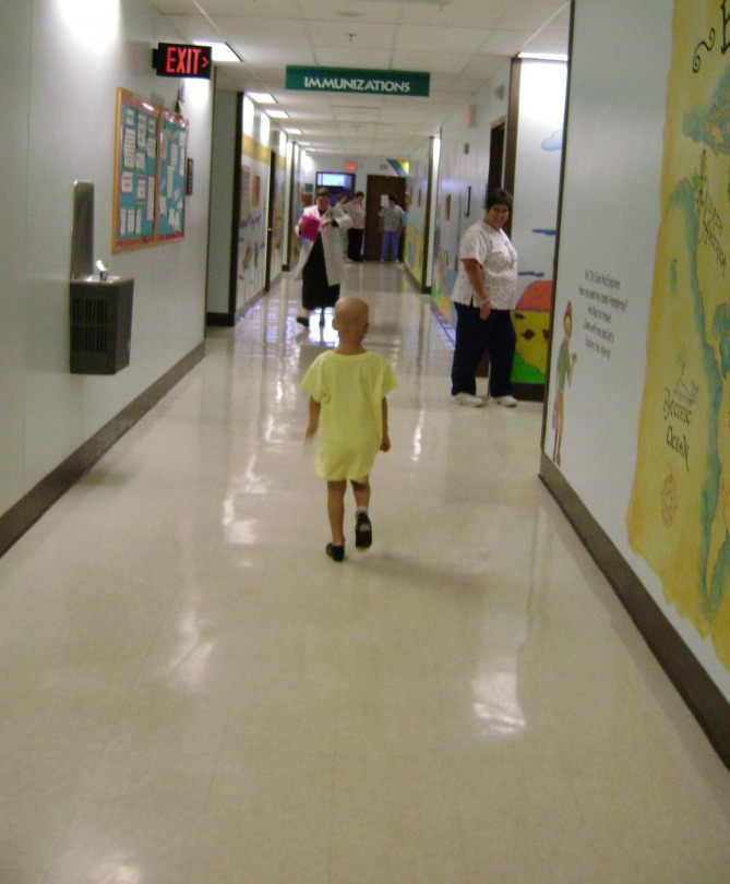 Lily walks down the hall wearing her tap shoes