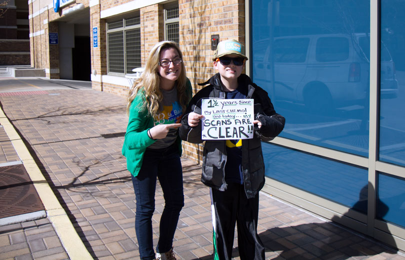 Ali and Chase with clear scans sign