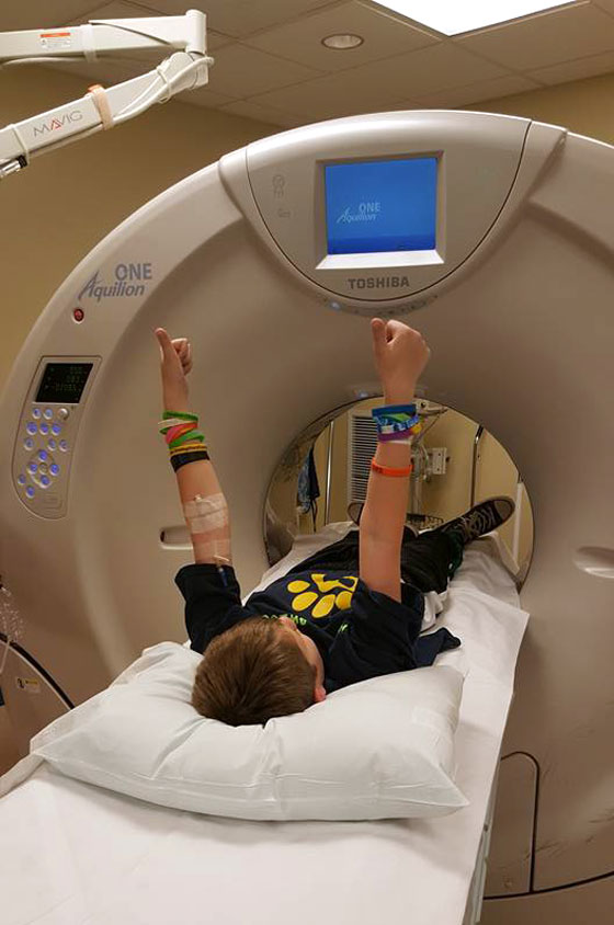Chase with thumbs up before starting the CT scan
