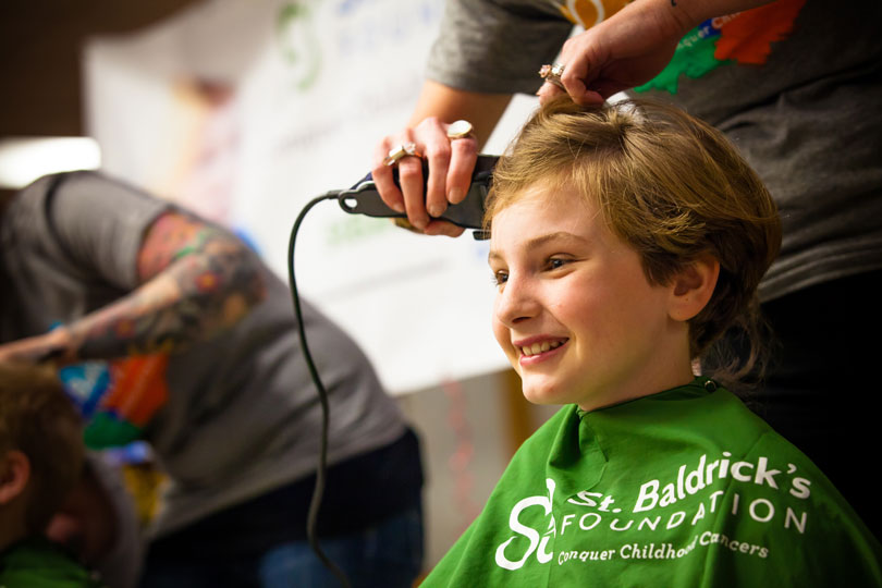 Chatfield Elementary School student getting shaved