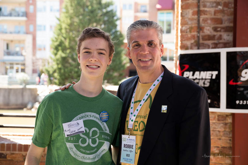 Robbie Tiffin and his son at event