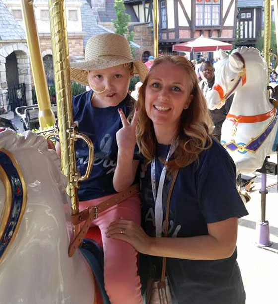 Avery and Stephanie on the merry-go-round