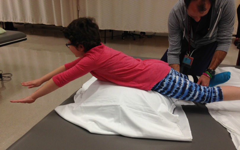 Elise does hip strengthening exercises during physical therapy