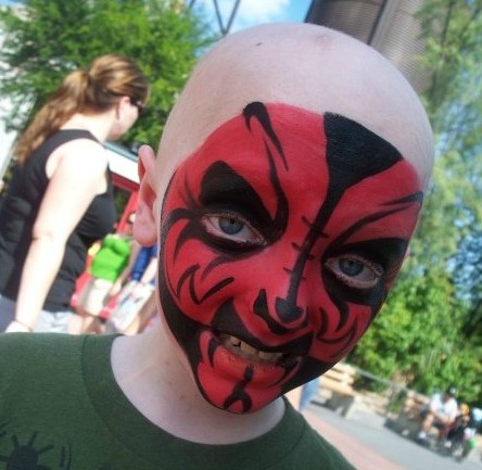 Ian mugs for the camera after getting his face painted like a Star Wars character