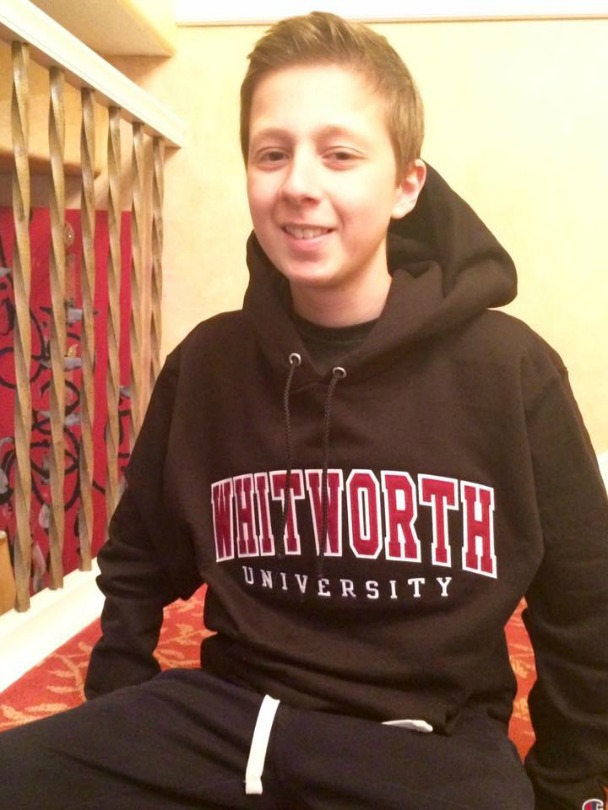 Mitch wears college sweatshirt