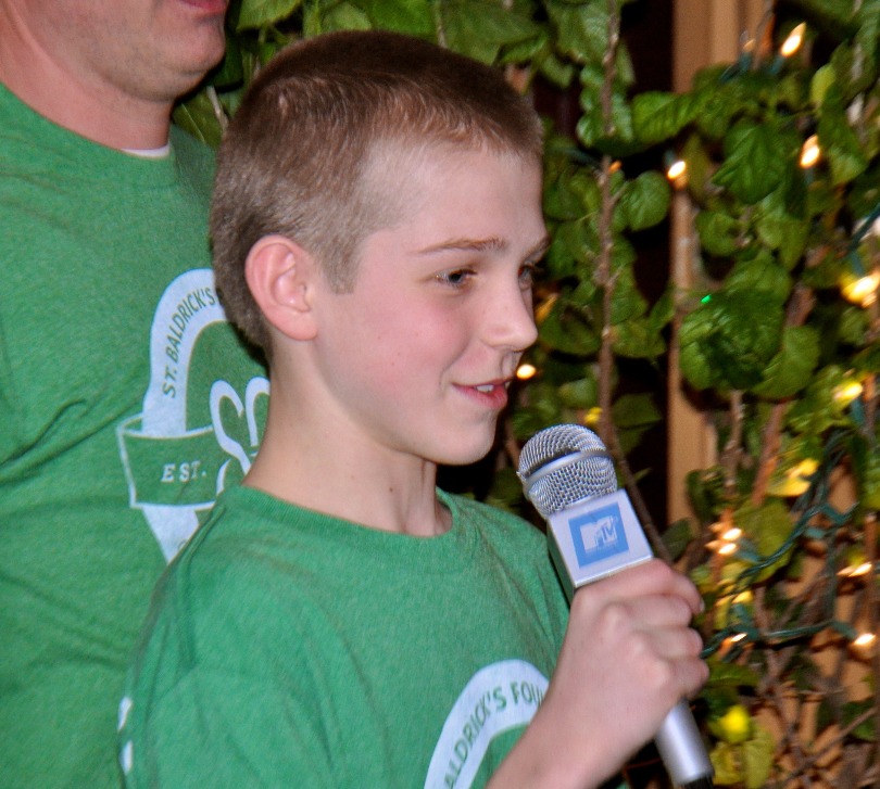 Joey speaks during his school event