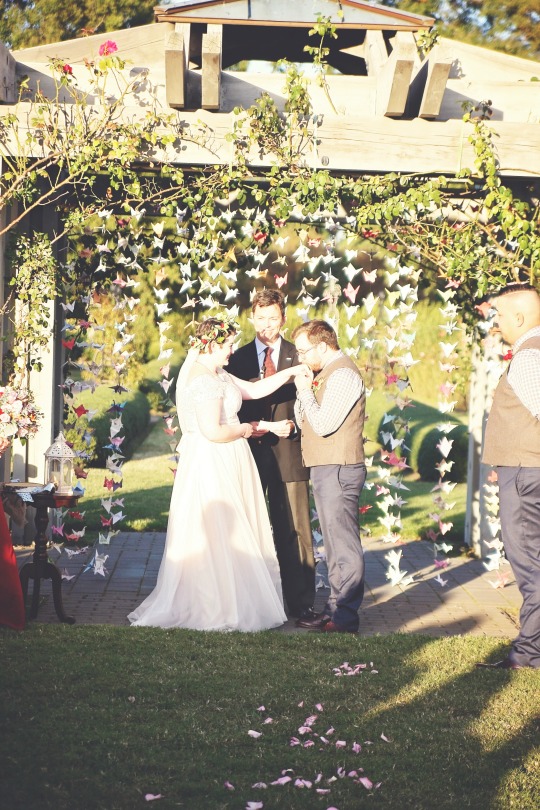 Patrick kisses Sarah's hand at the altar