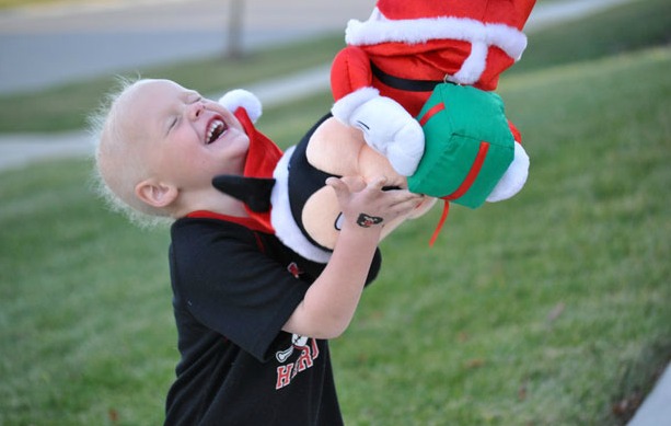 Holden plays with a stuffed animal