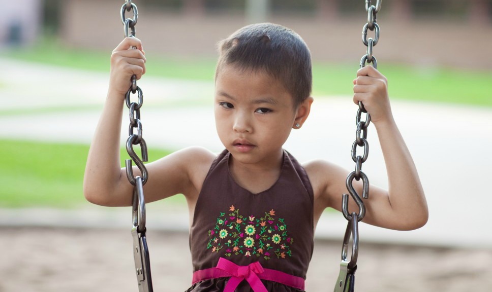 Daisy plays on a swing