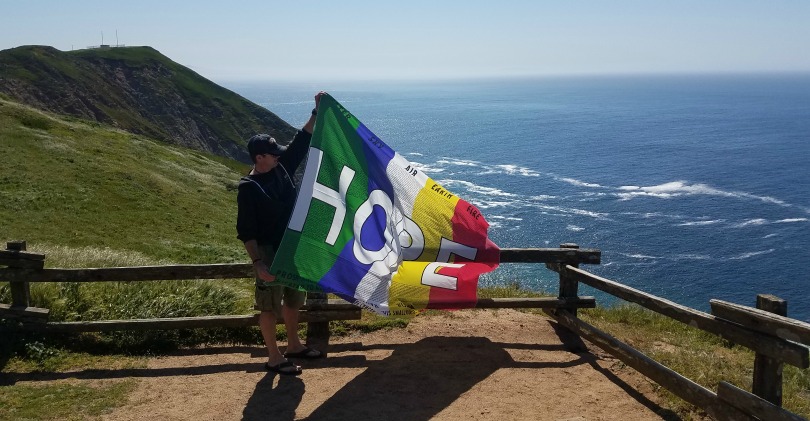 Sean holding the flag of hope.