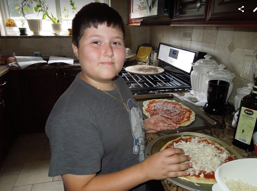 Petey with his famous pizza