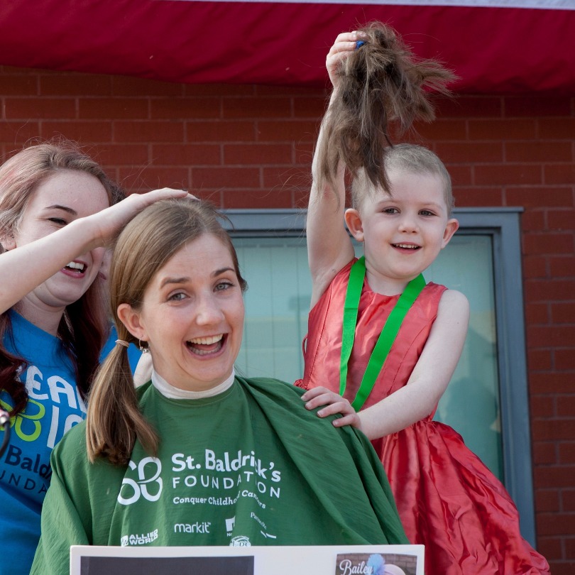 Grace helps shave Melissa's head