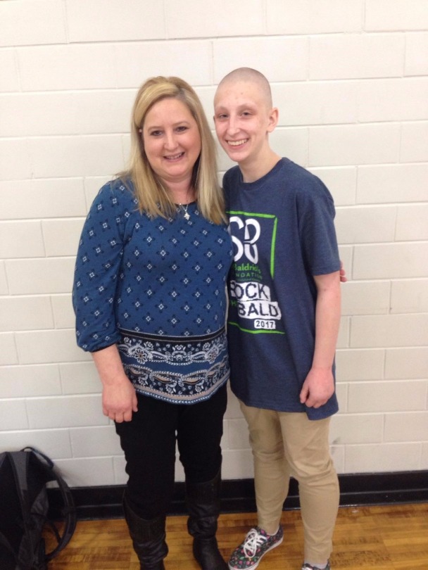 Alyssa smiles with her mom after shaving her head