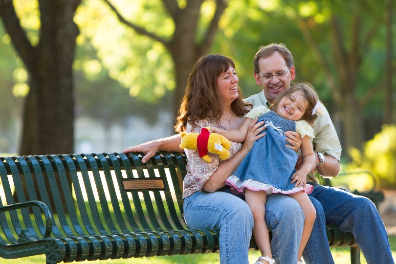 Ron and Michelle Rozman cuddle with their daughter Amanda