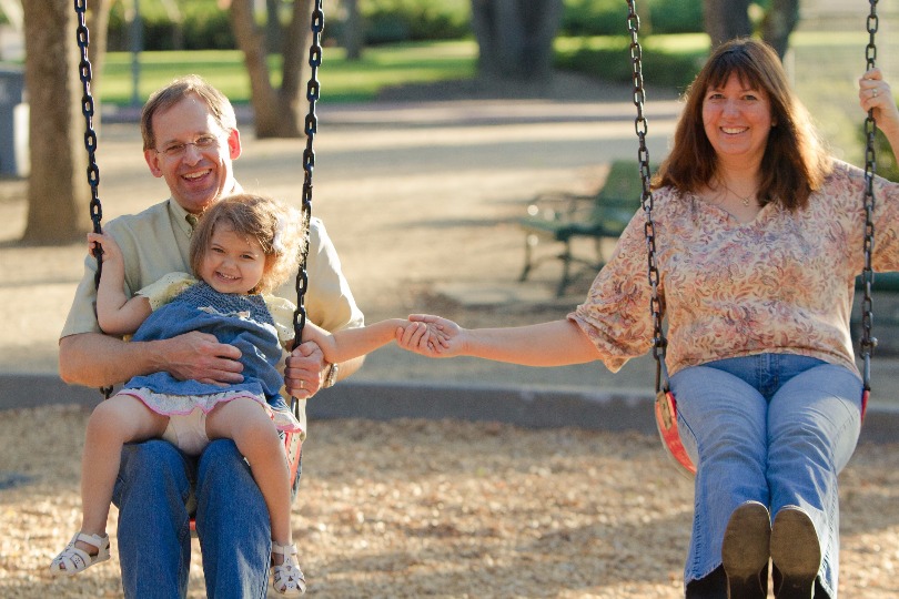 Ron and Michelle Rozman swing with their daughter Amanda