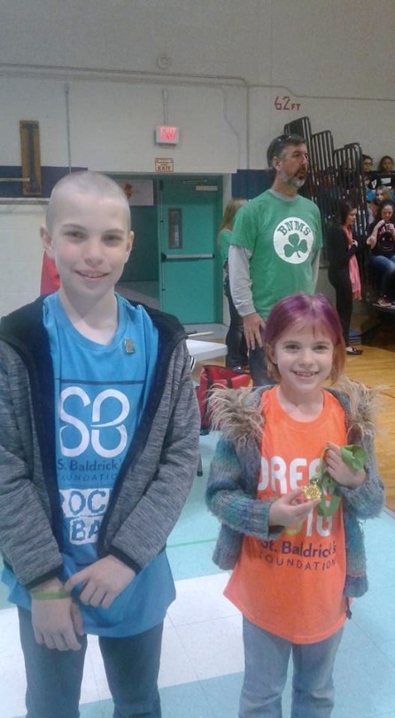 Hunter with his sister during their 2017 shave