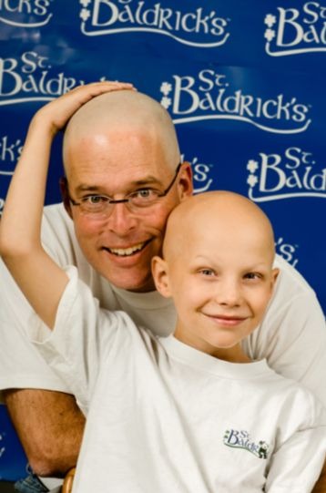 Joey and his dad, Chuck, show off their bald heads