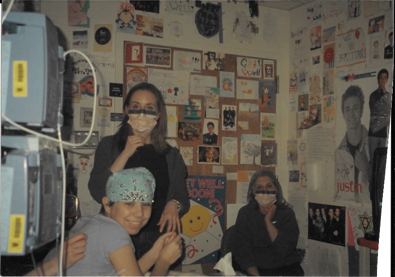 Brittany in her hospital room with her aunt and cousin