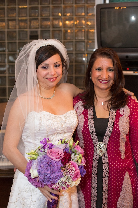 Brittany smiles during her wedding day with her pediatric oncologist