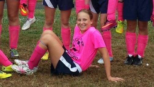 Kelsey in her soccer uniform