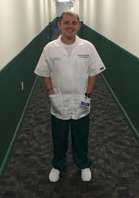 Tyler in his nursing uniform