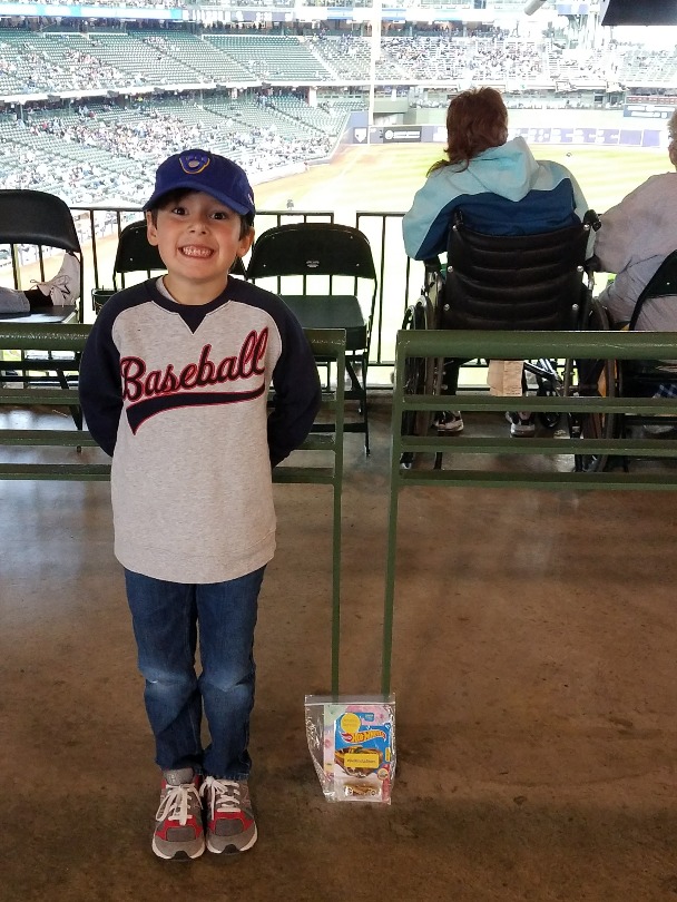 Henry and a Brooks Hot Wheels car at a Major League Baseball game