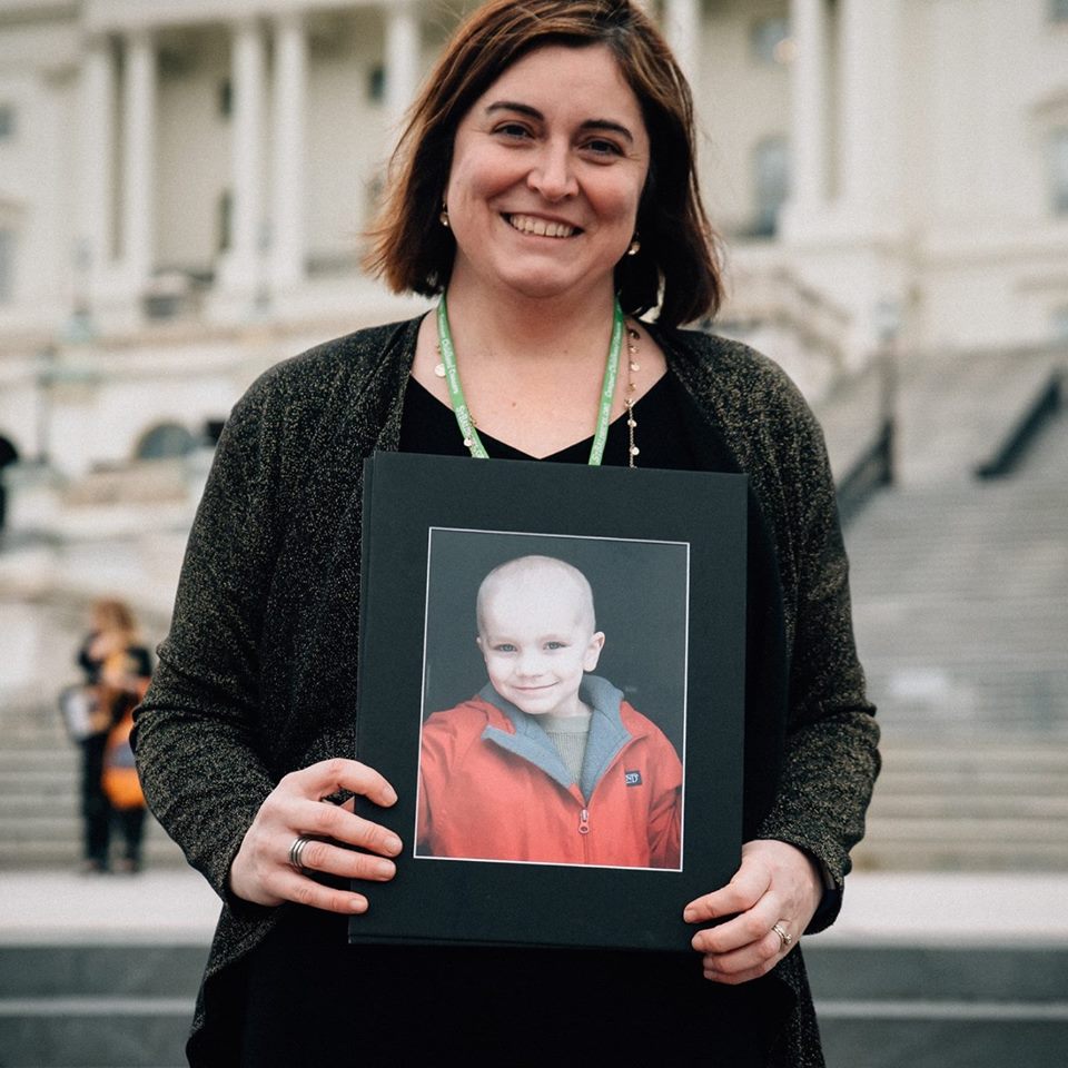 Danielle holds a photo of Mason