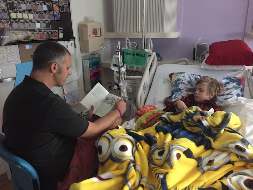 Dan reads to Sullivan during his treatment