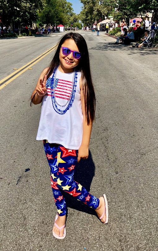Emma Sophia rocks sunglasses and a peace sign
