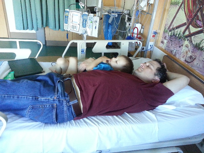 Micah and Jeff rest in the hospital